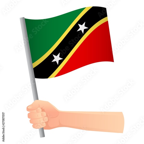 Saint Kitts and Nevis flag in hand © Visual Content