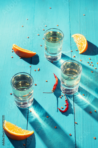 Canvas Print Mexican mezcal shots with slice of orange fruit