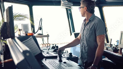 dynamic positioning officer operationg bridge ship equipment of offshore dp vessel thruster pitch propellers and joystick system photo