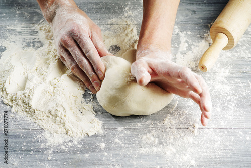 Photography Cook hands knead the dough.Close-up.