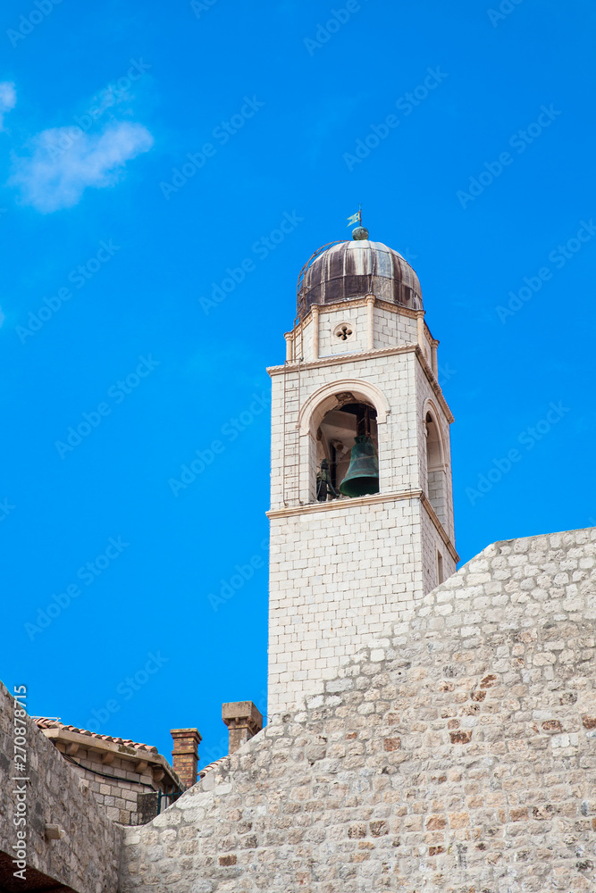 Clock tower of Dubrovnik old town seen from the city old port Clock tower of Dubrovnik old town seen from the city old port