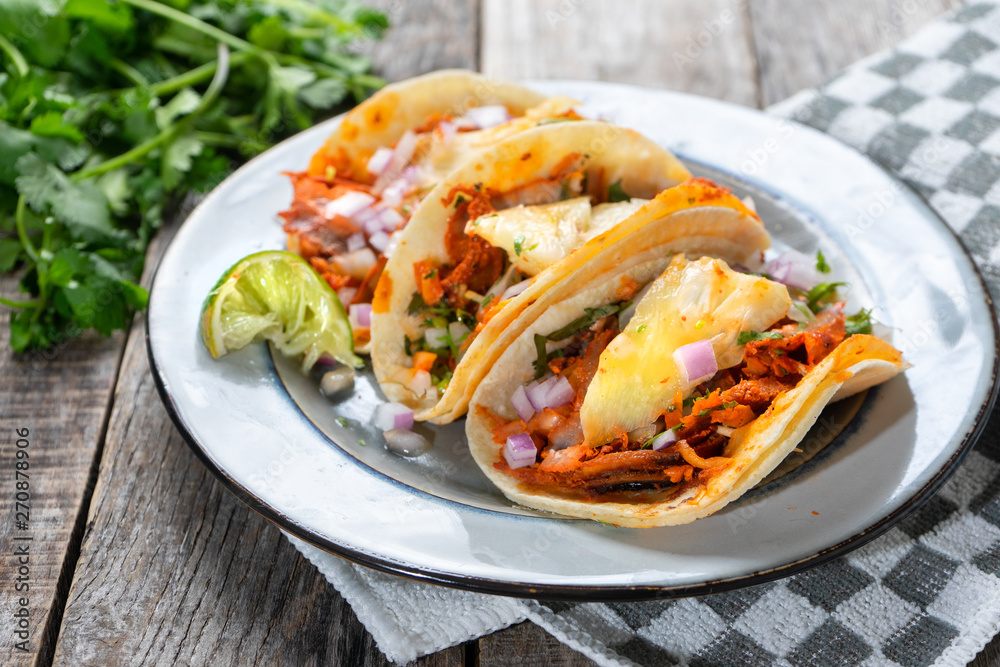 Mexican food: Authentic tacos al pastor with lime and pineapple Mexican food: Authentic tacos al pastor with lime and pineapple