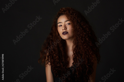 Cute young woman with curly hair
