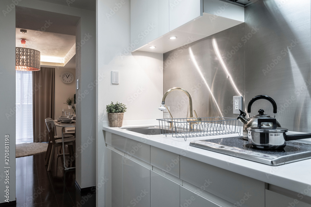 Small stainless steel kitchen set in a small apartment Small stainless steel kitchen set in a small apartment