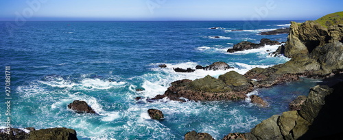 Photography Panoramic view of coastline scenery of blue sky with rocks and sea on Pacific Co