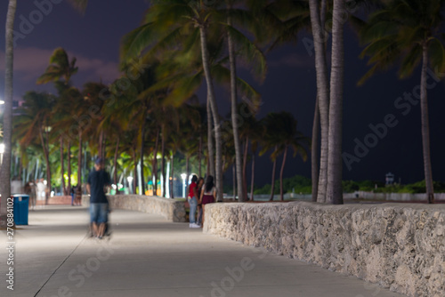 People on Ocean Drive pedestrian walkway Lummus Park at night