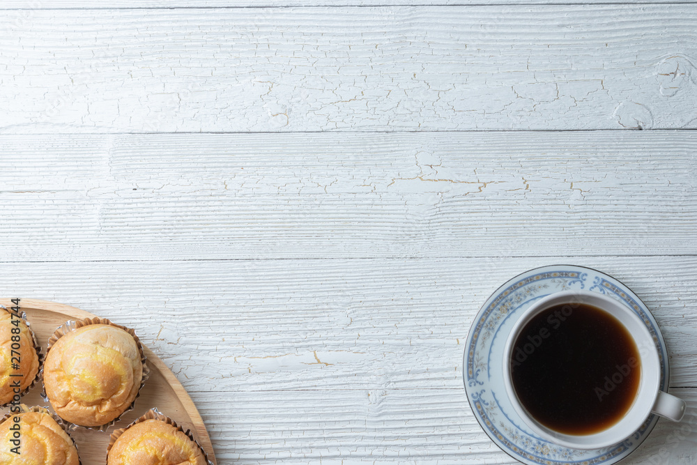 cup of coffee and shredded pork bun on wooden plate cup of coffee and shredded pork bun on wooden plate