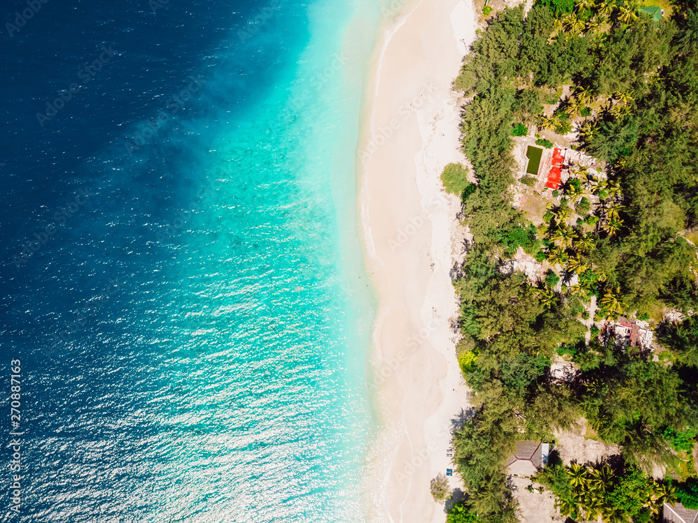 Tropical island with beach and blue ocean. Aerial view.