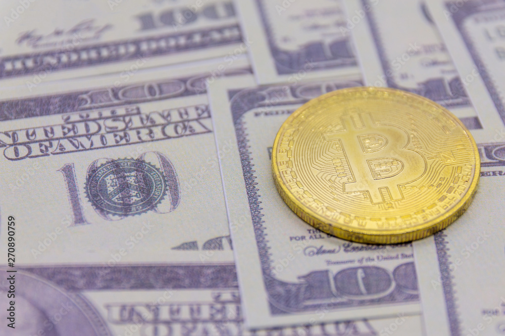 Golden bitcoin coin on us dollars Golden bitcoin coin on us dollars