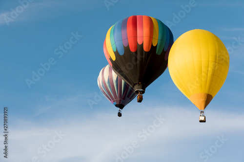 Multi colored hot air balloons on blue sky © Mariusz Blach