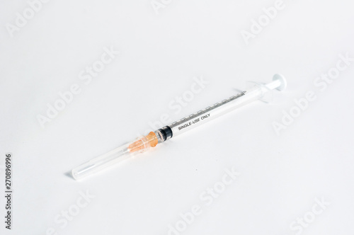 Close up new injection needle isolated on white background