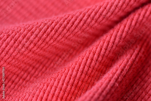 Textile texture coral color close up. Textile background