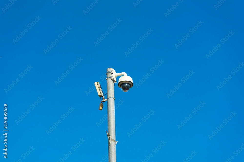 Outdoor surveillance camera on a pole Outdoor surveillance camera on a pole