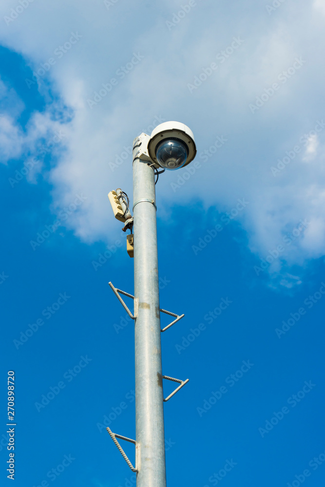 Outdoor surveillance camera on a pole Outdoor surveillance camera on a pole