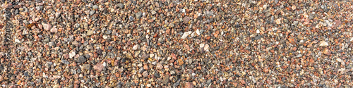 Sea pebble texture. Small multicolored pebble-stones. Sea pebble texture. Small multicolored pebble-stones. Beach stones header design. Close up beach stones surface.