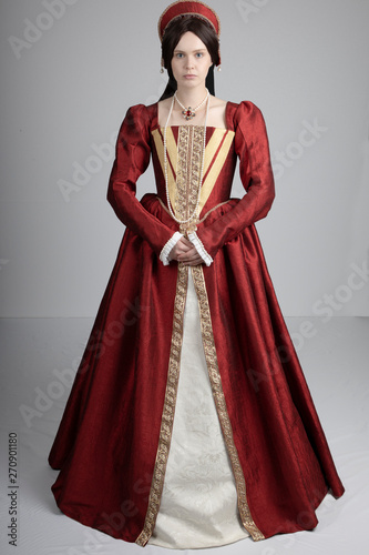 Dark-haired Tudor woman in red dress