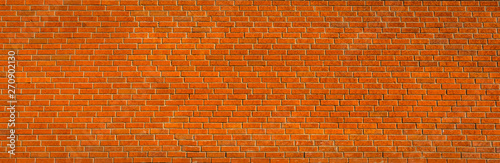 Bricks texture. Panorama large red orange brick wall pattern texture. Masonry background. 