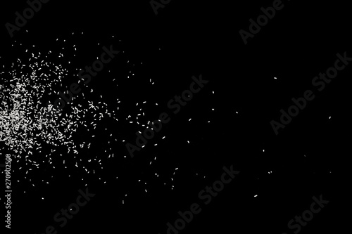 White falling particles round shape on black backround.Glowing blizzard. Scatter falling round particles.