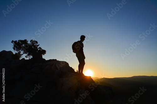 silhouette, sunset, sky, mountain, woman, female, sun, people, freedom, sunrise, nature, person, success, happy, joy, success, power, landscape, running, black, standing, outdoors, happiness, sport © ANCESTOR
