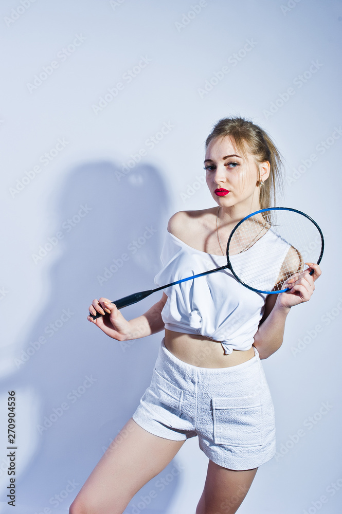 Amazing fit sexy body brunette caucasian girl posing at studio against  white background on shorts and top with badminton racket. Stock Photo |  Adobe Stock