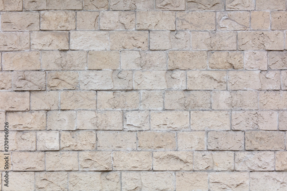 Decorative bricks on the wall of the house as a background Decorative bricks on the wall of the house as a background