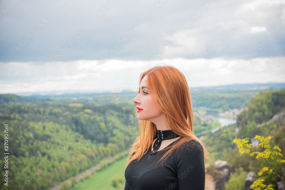 Tourism concept, pretty romantic woman look at beautiful view in mountains , Vacation in Saxon Switzerland 