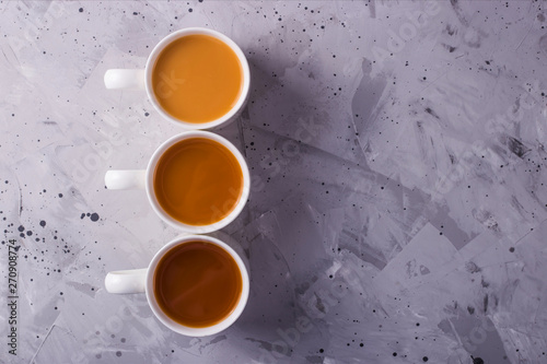 Masala tea or coffee with a different amount of milk and a different color gradient