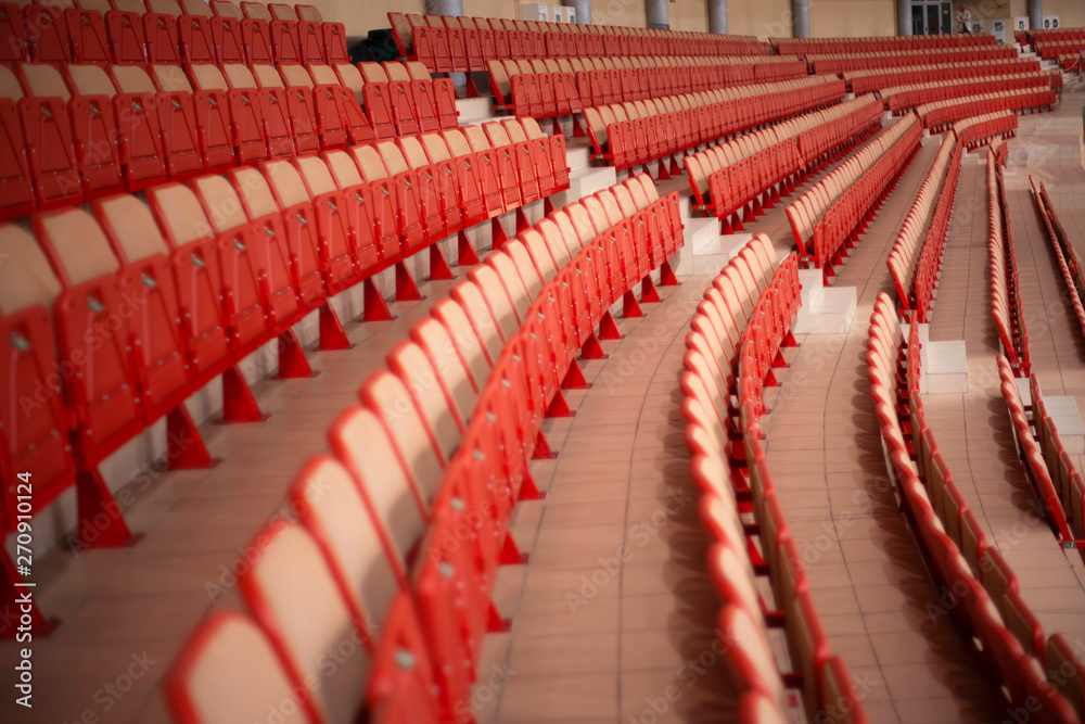 Fototapeta premium Empty colored chairs at the stadium
