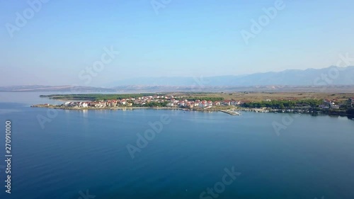 Wallpaper Mural Wide angle view of drone flying above open sea towards town Povljana in Croatia in sunlight in summer. Torontodigital.ca