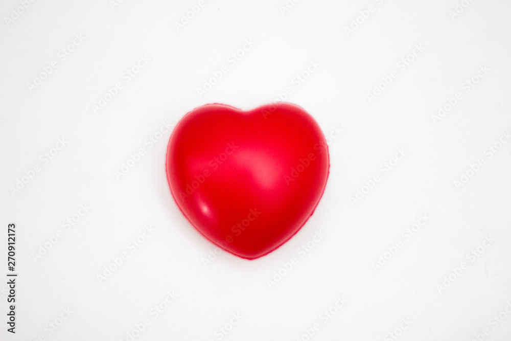 Heart in the hands of a man close up. Close up on female hands giving a red heart as a heart donor. Sign of compassion and health.