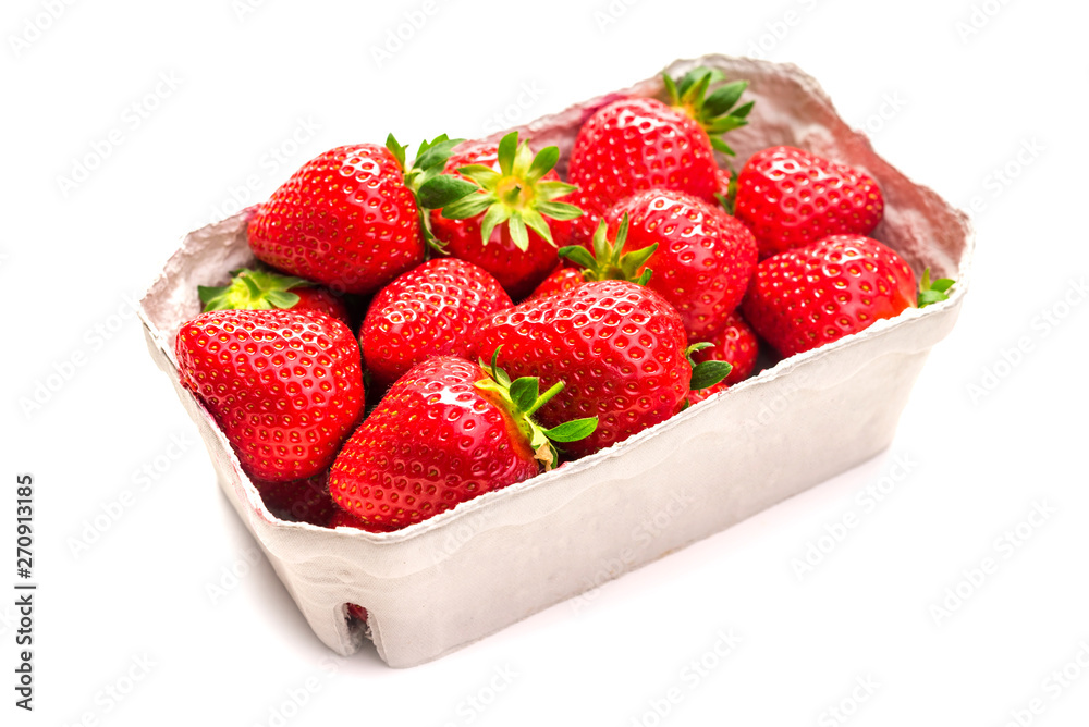 Ripe strawberries in a cardboard box on a white background, isolate Ripe strawberries in a cardboard box on a white background, isolate