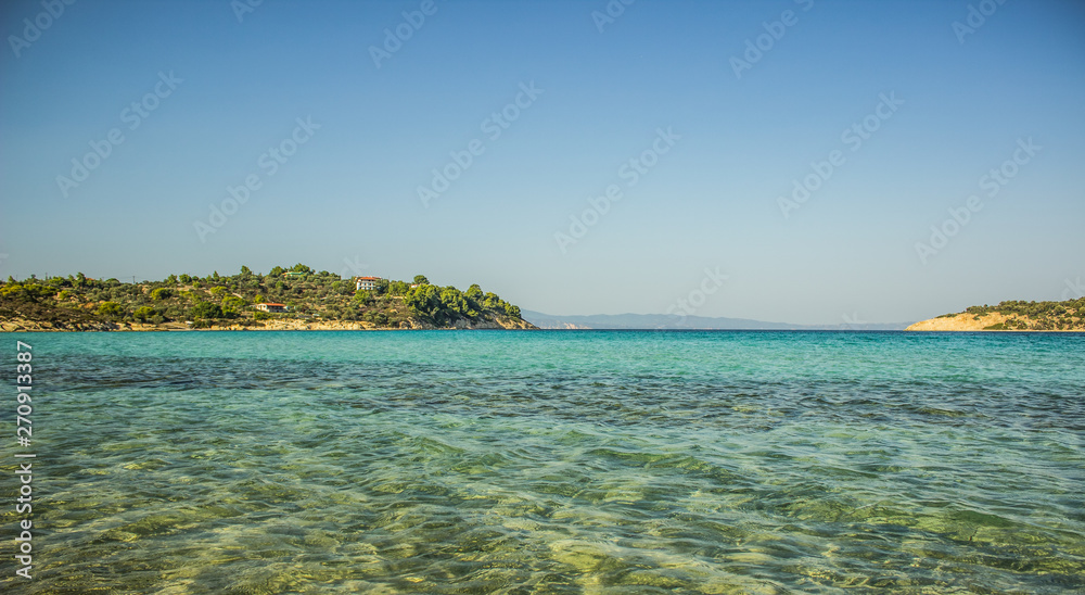beautiful picturesque summer vacation destination for relax scenery landscape photography of Greece island in Mediterranean sea panoramic picture with water surface foreground and empty space for text