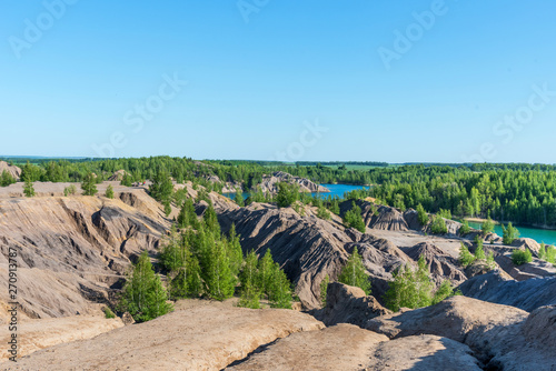 Aerial view of picturesque hills and blue lakes in Konduki, Tula region, Russia. Turquoise quarry in Romantsevo. photo