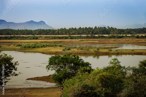 beautiful lake view with mountains in the distance in the south of india