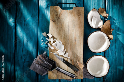 Fresh coconut on blue wooden table and free space for your decoration. 