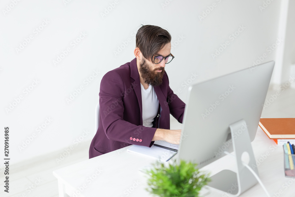 People and technology concept - Man sits and works at the computer People and technology concept - Man sits and works at the computer