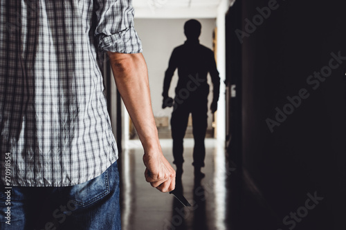 Bandit man is attacking with knife on people in the condo. Killer a knife broke into the apartment.