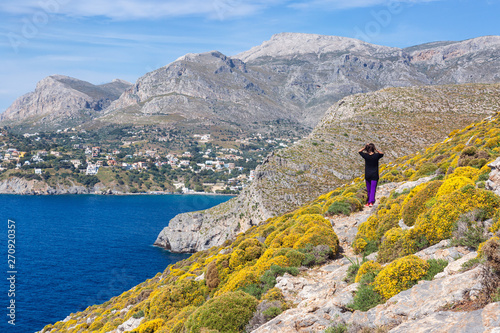 Young woman enjoying beautiful view. Kalymnos Island, Greece.