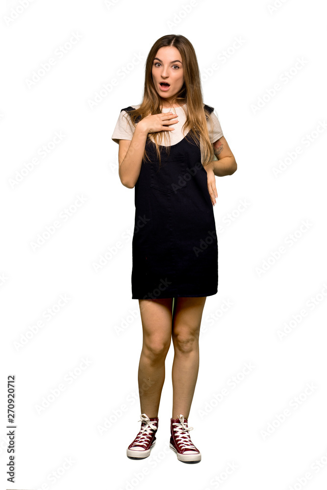 Full body Young pretty woman surprised and shocked while looking right on isolated background Full body Young pretty woman surprised and shocked while looking right on isolated background