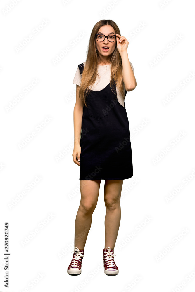 Full body Young pretty woman with glasses and surprised on isolated background Full body Young pretty woman with glasses and surprised on isolated background