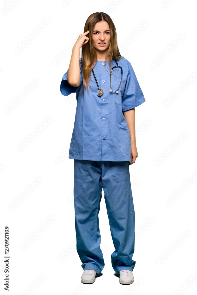 Full body Young nurse making the gesture of madness putting finger on the head on isolated background Full body Young nurse making the gesture of madness putting finger on the head on isolated background