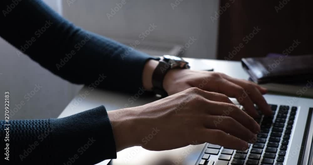 Businessman working at the computer. young man typing on laptop. Freelancer works for noutbokom. Businessman working at the computer. young man typing on laptop. Freelancer works for noutbokom.