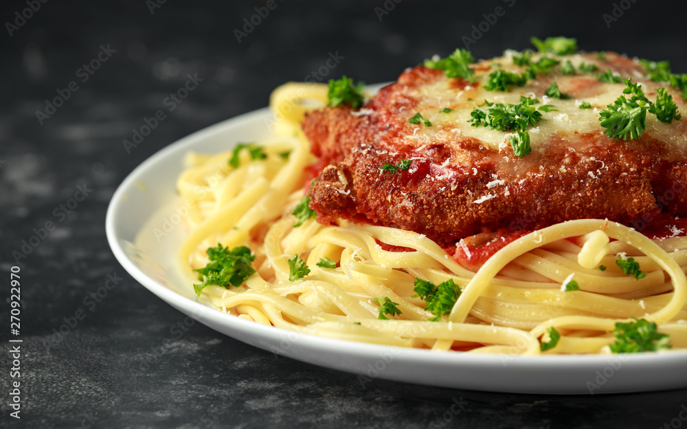 Chicken Parmesan with Cheese and Marinara Sauce served over spaghetti, pasta Chicken Parmesan with Cheese and Marinara Sauce served over spaghetti, pasta