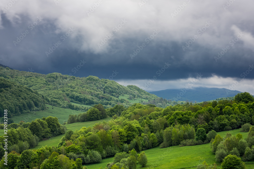 Dramatic stormy weather clouds over peaks in Bieszczady National Park, Poland Dramatic stormy weather clouds over peaks in Bieszczady National Park, Poland