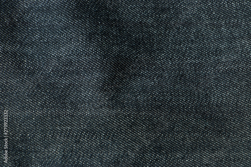 Black jeans fabrics background, The Close up black jeans texture.