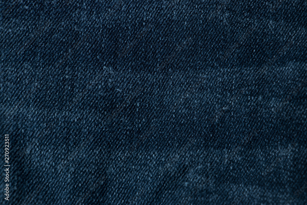 Naklejka premium Blue Navy jeans fabrics background, The Close up blue jeans texture.