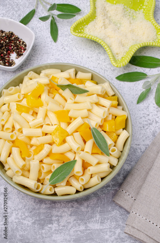 Pasta with slices of yellow pepper photo