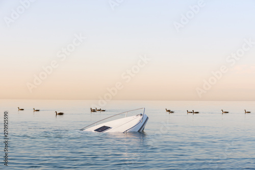 Sinking modern large white boat goes underwater © artemzavarzin