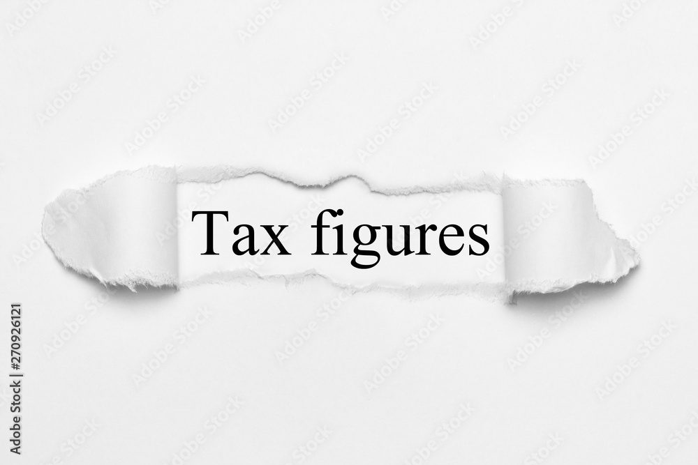 Tax figures on white torn paper Tax figures on white torn paper