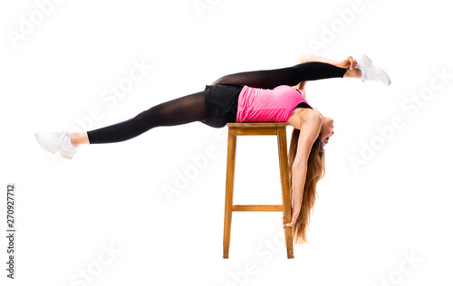 Young dance girl over isolated white background stretching